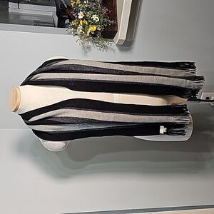 Scarf gray and black striped with fringe. By Fownes 💯% acrylic. 10" X 60".‎
